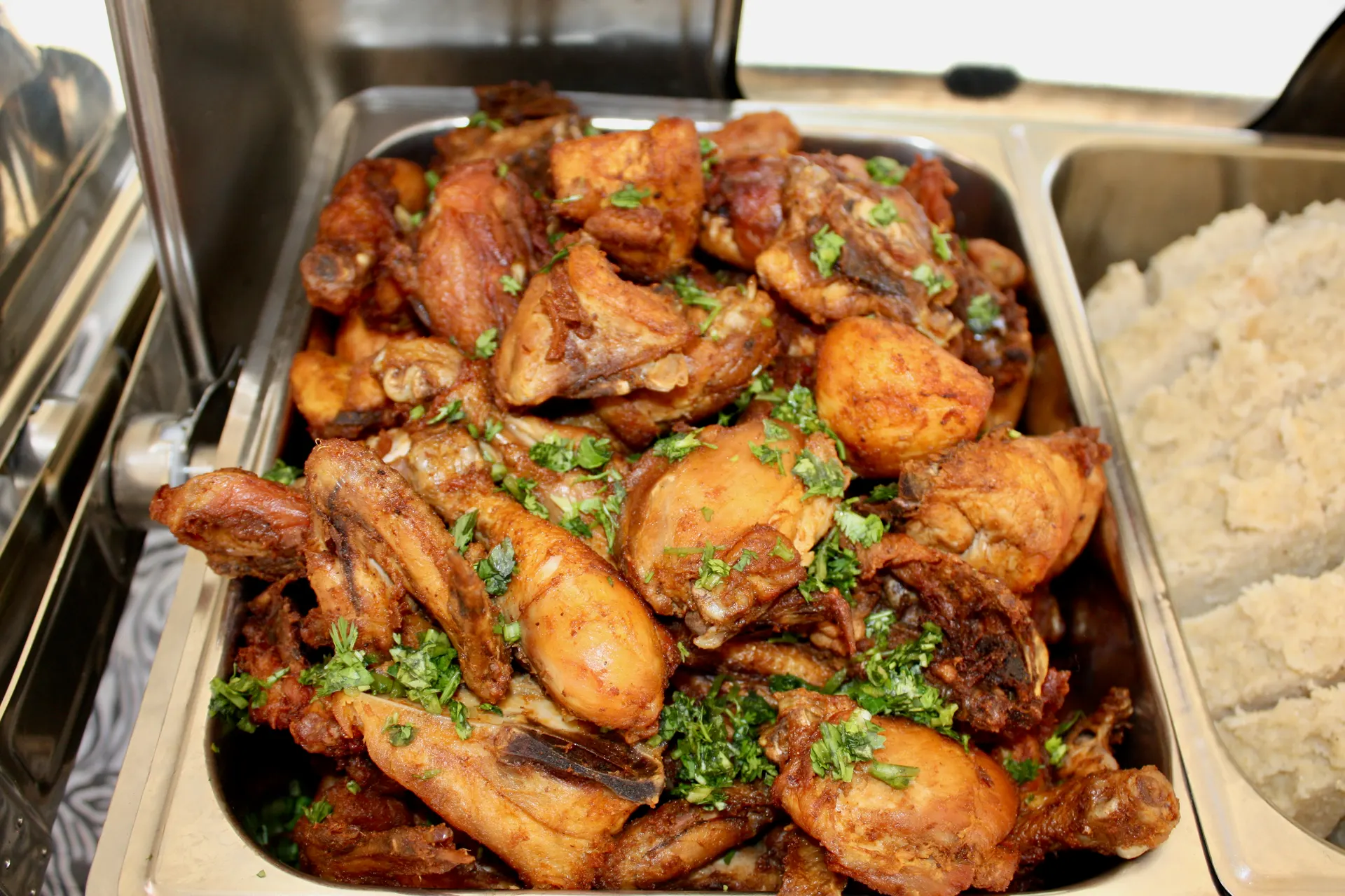 Fried chicken and rice buffet trays set up for service